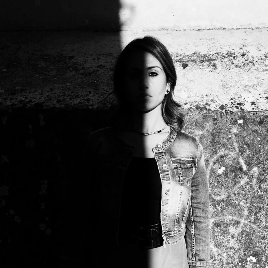 Sofia Dell'Aversano Orabona, black-and-white portrait split between light and shadow